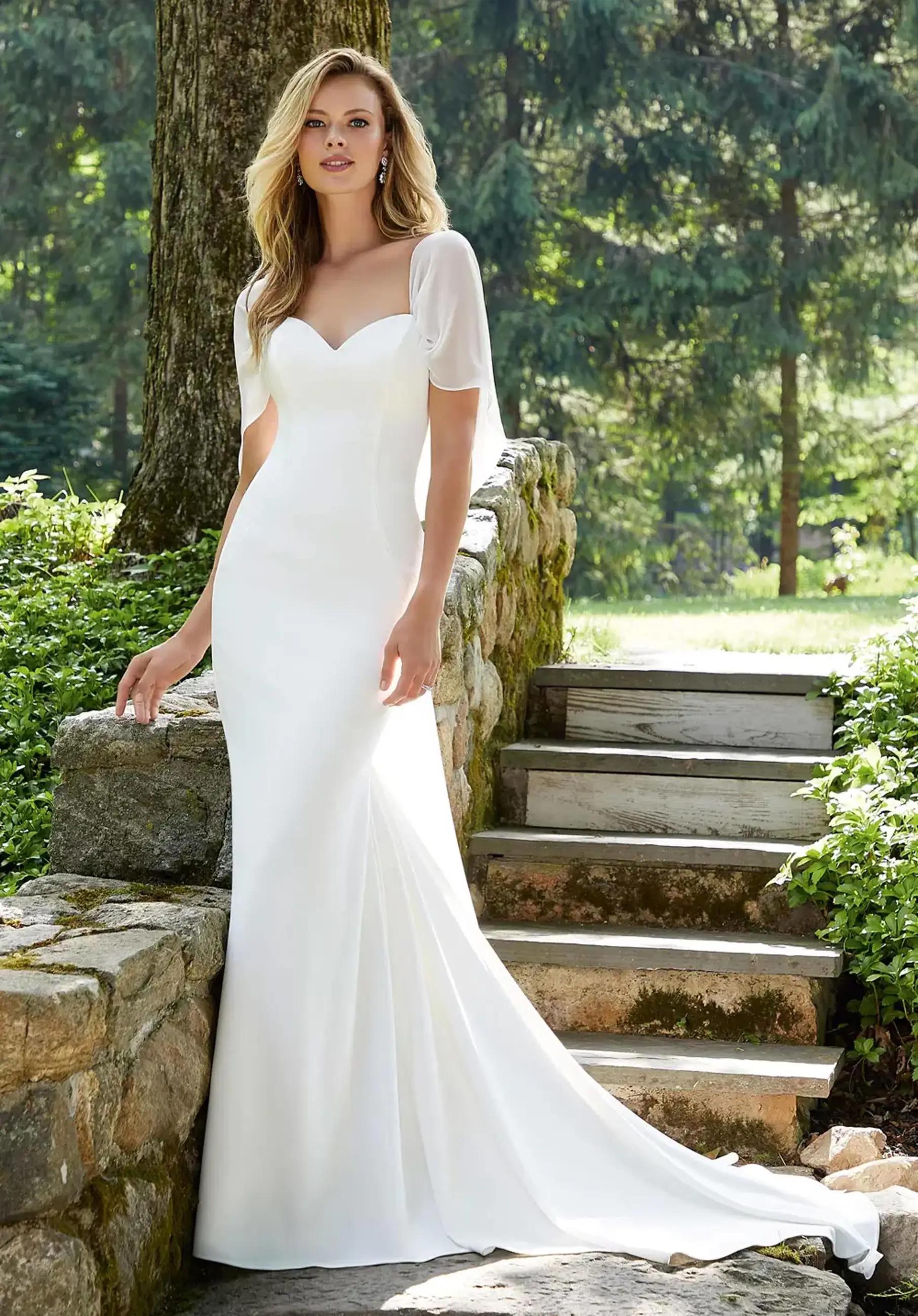 Model wearing a Morilee White Dress gown