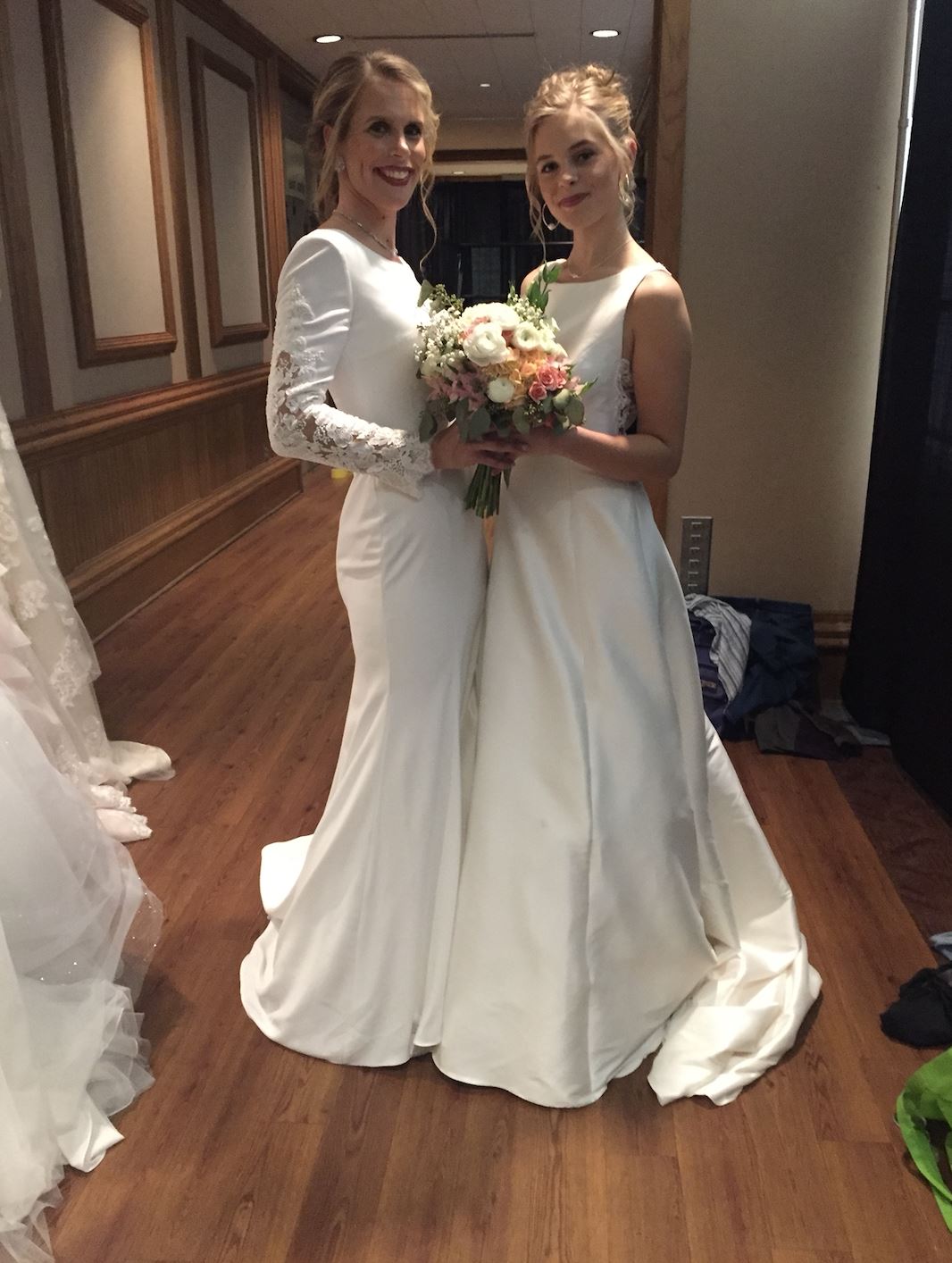 Photo of the real brides holding a bouquet