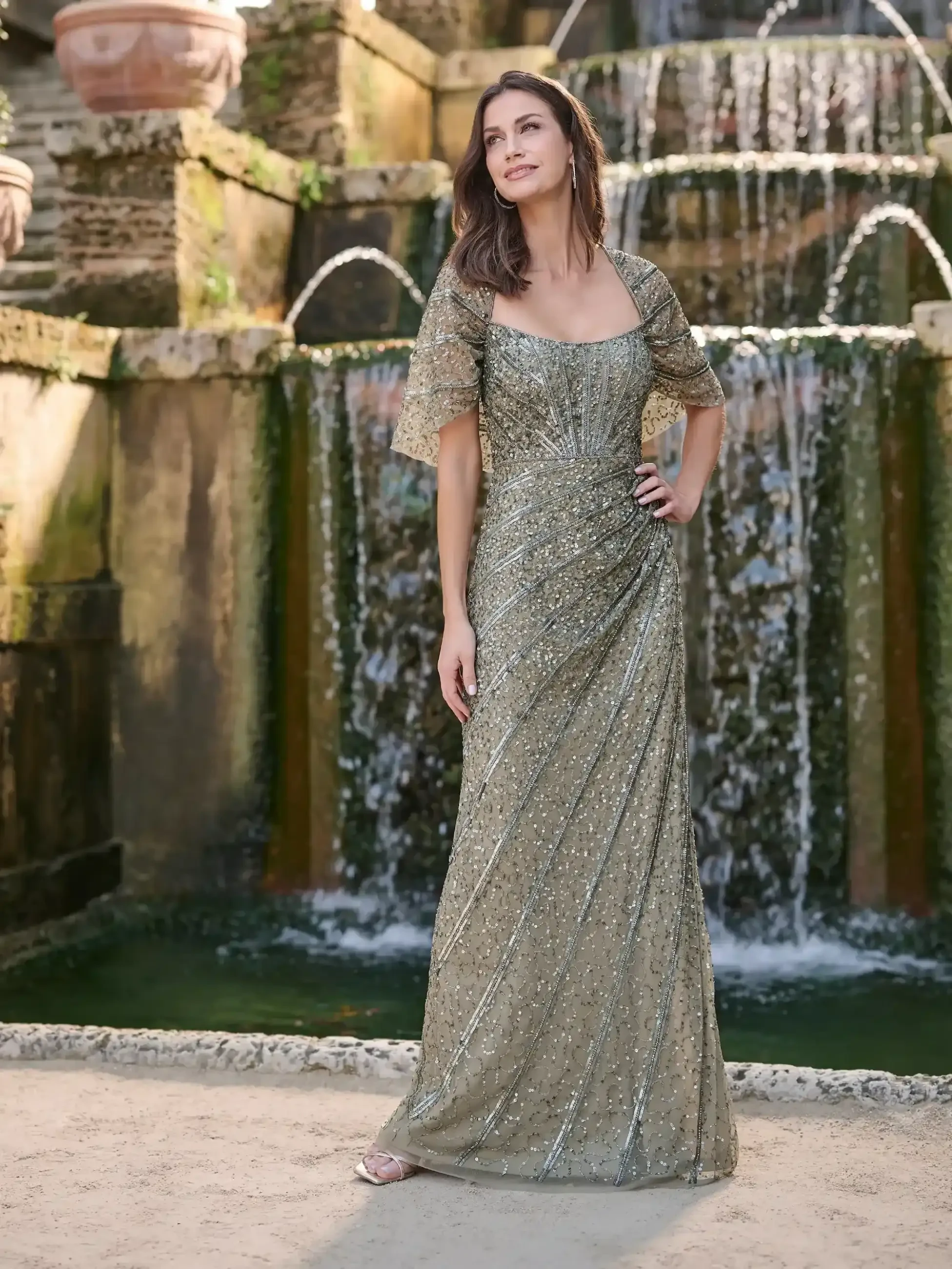 Model wearing a Adrianna Papell Platinum gown