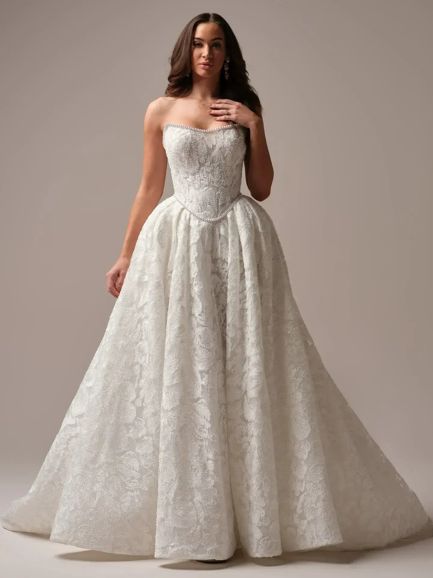 Model wearing a Sottero and Midgley white wedding gown