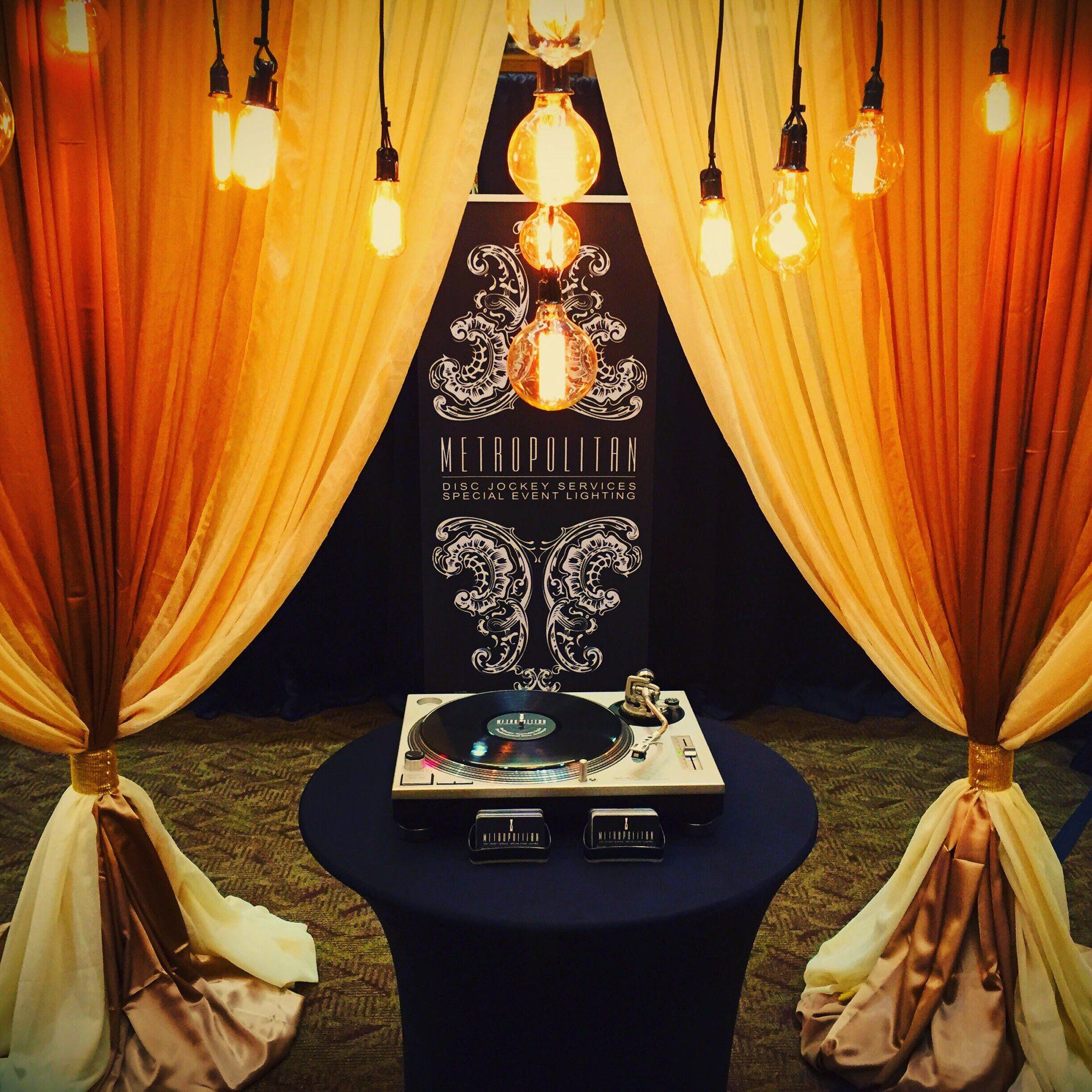 Photo of a wedding photo booth with a vinyl player