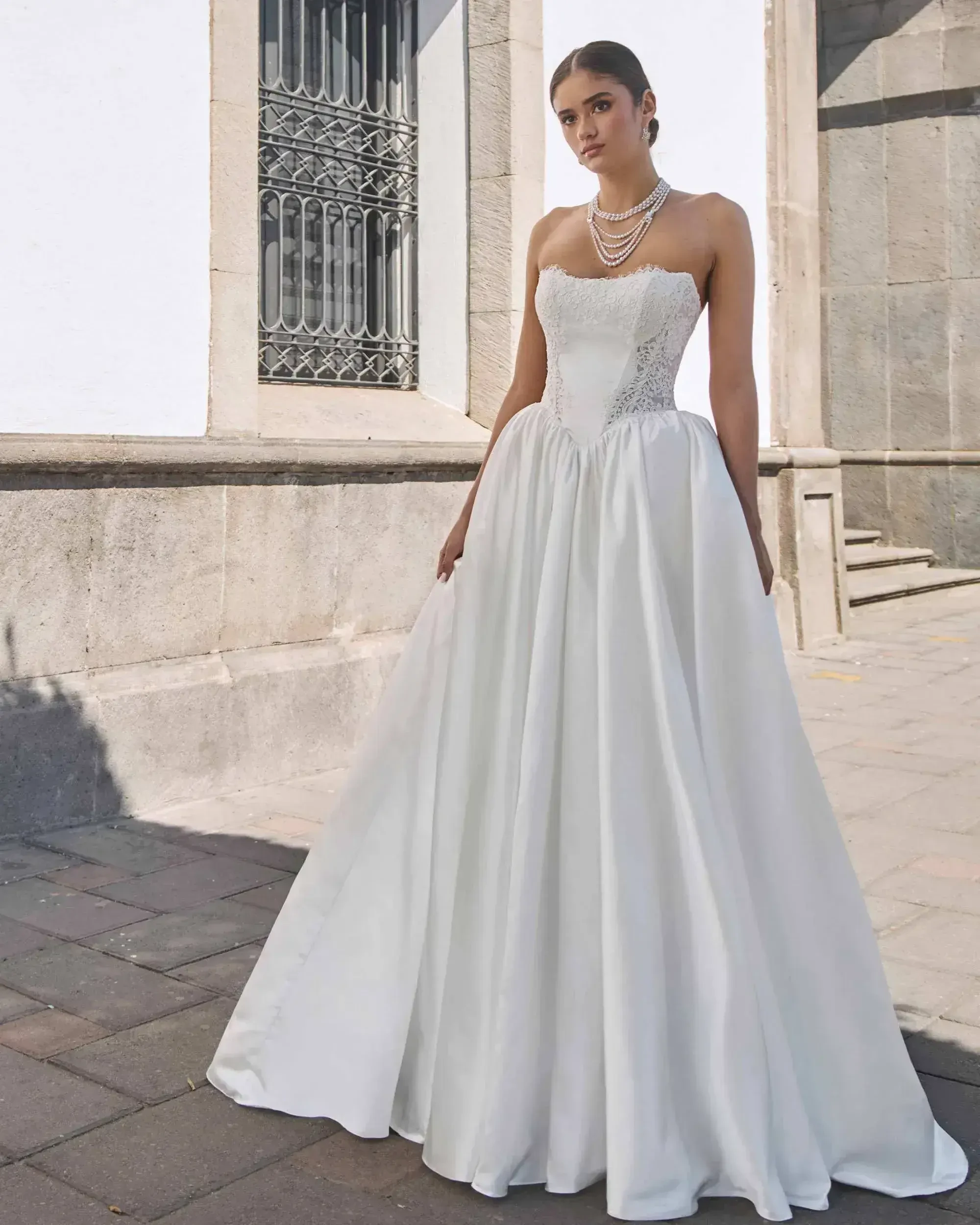 Model wearing a L'amour by Calla Blanche gown